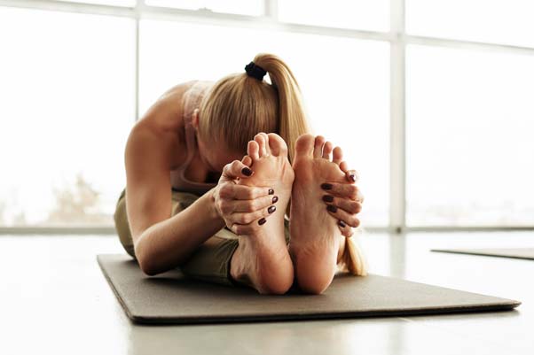 Seated Forward Bend Paschimottanasana menopause yoga
